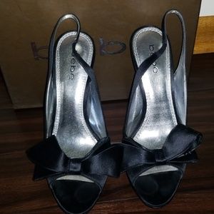 BEBE Black satin Bow platform heels.